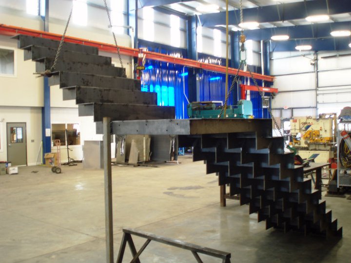 Construction of the zig zag, floating staircase at the Pro Weld facility. 