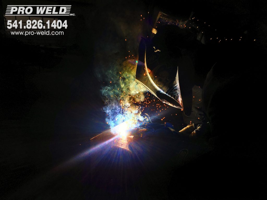 Gavin Frazier, certified welding employee pumps out the welds as he joins metals on this substation steel. 